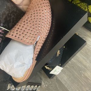 Flat slides with studs.